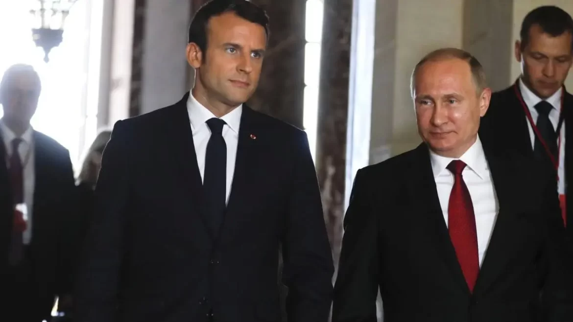 Putin-Macron French President Macron and Russian President Putin walk side by side during diplomatic meeting.