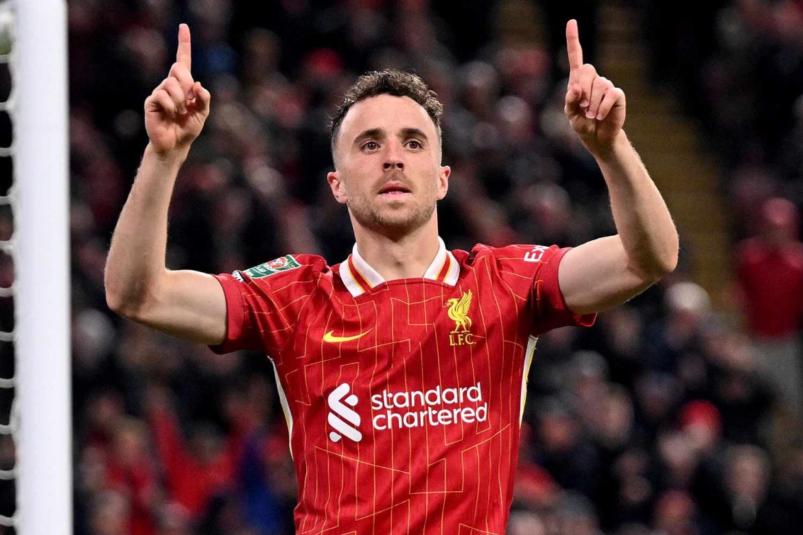 diogo-jota-070325-2-ad67069a771b4d0b9b65f08356f613f2 Liverpool FC forward Diogo Jota raises both hands during a match, wearing the club's red jersey—image often referenced in discussions and tributes following rumors surrounding Diogo Jota death.