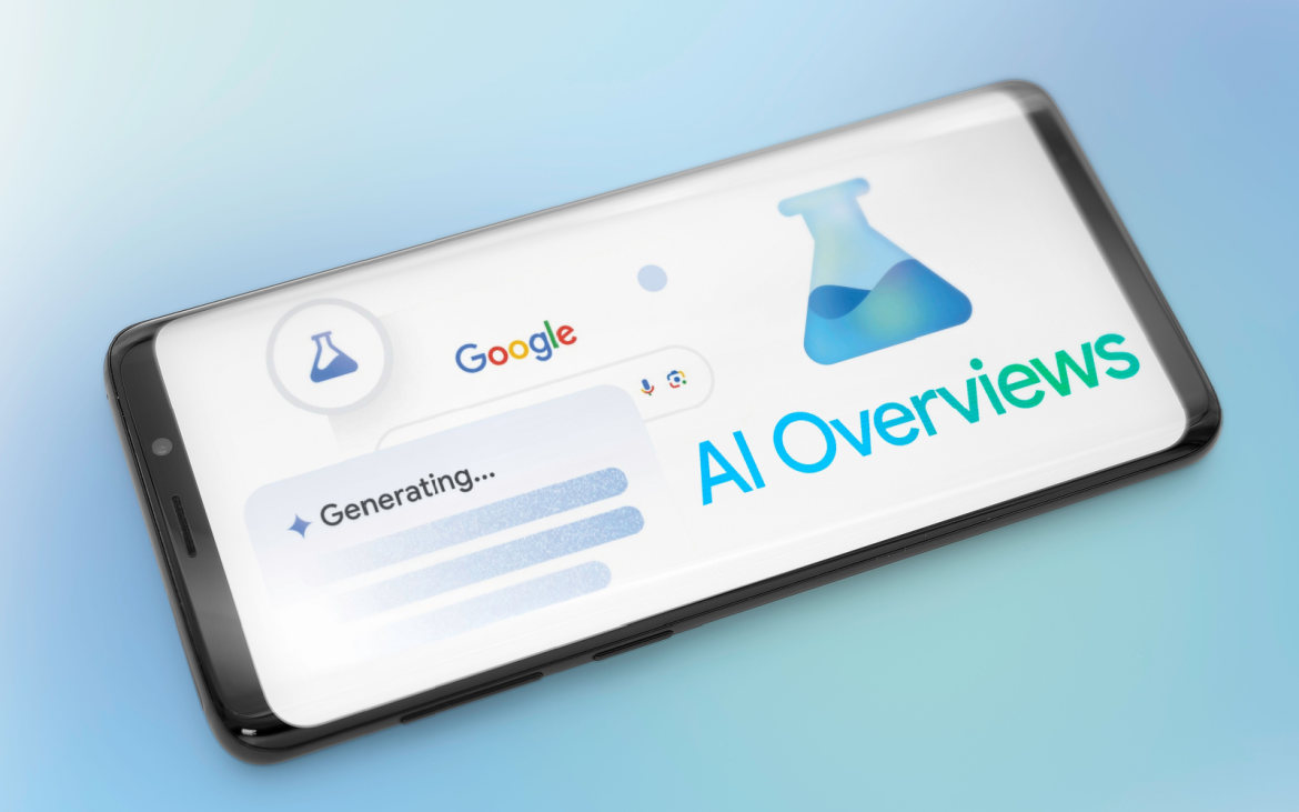 shutterstock_2464048639-605 The image shows a smartphone screen displaying a Google search interface with the word "Generating..." on the search bar, indicating a process in progress. The screen also features the logo for "AI Overviews" in blue and green text, accompanied by an icon of a laboratory flask. The background is a soft gradient of light blue, creating a modern and tech-focused atmosphere.