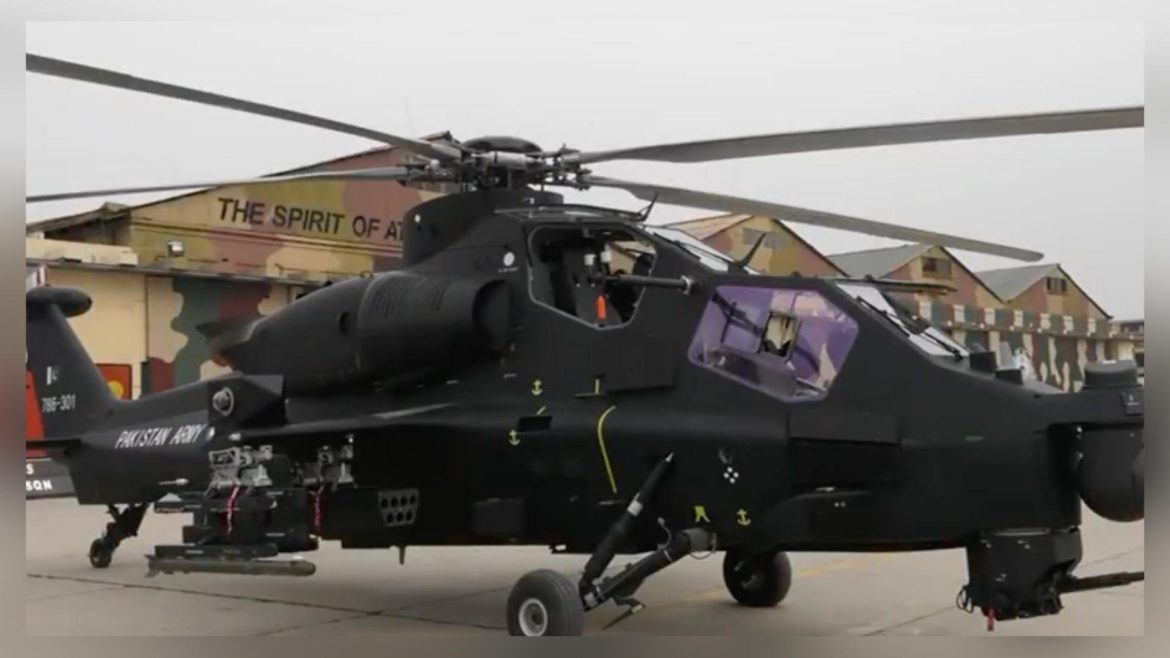 A sleek, black attack helicopter, marked "Pakistan Army," sits on a tarmac in front of camouflage-painted buildings.