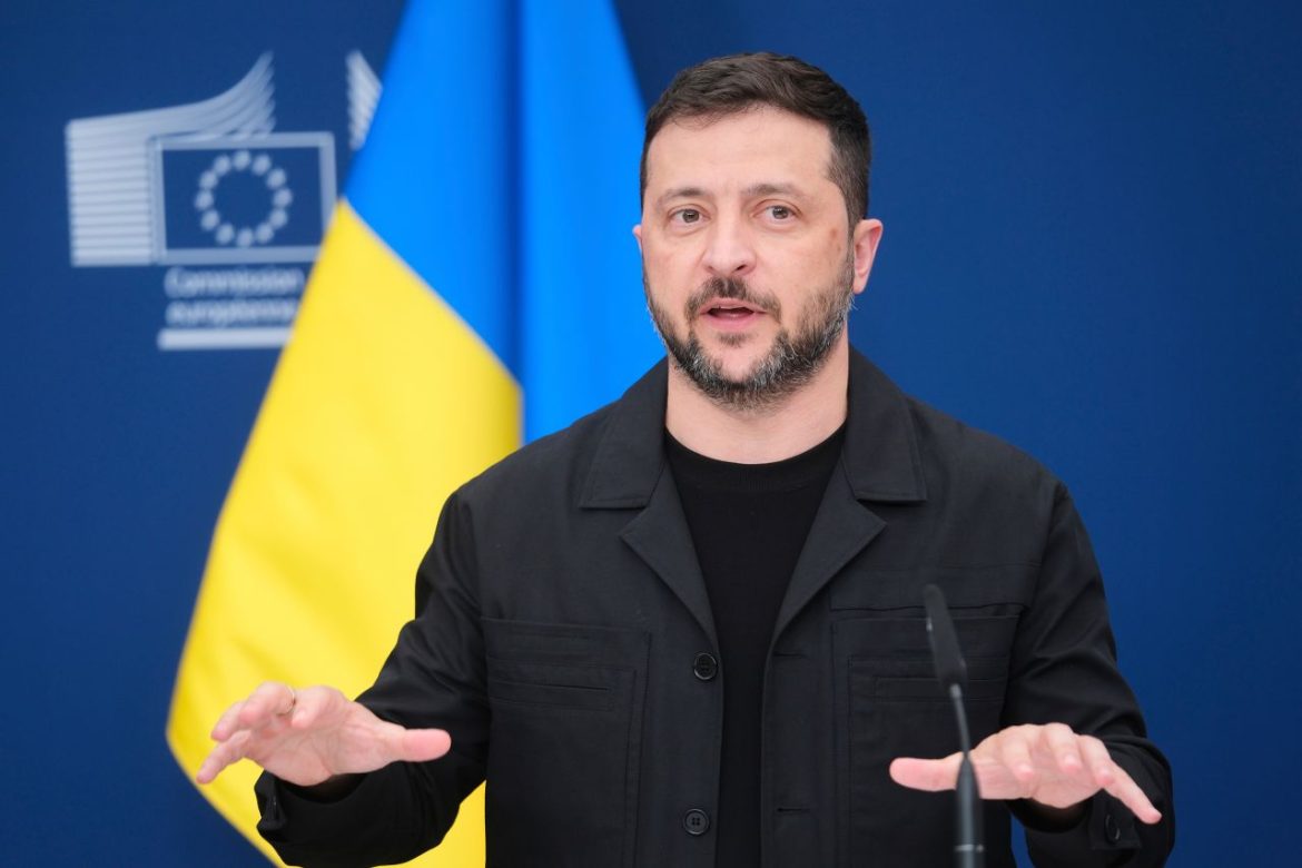 A speaker gestures passionately at a podium, with European and Ukrainian flags displayed in the background.