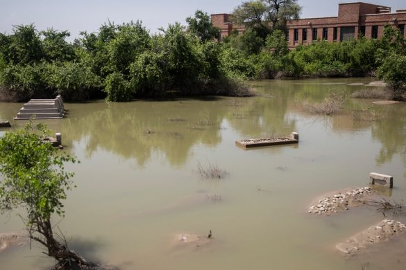 Pakistan Floods Force Funeral Procession to Cemetery by Boat