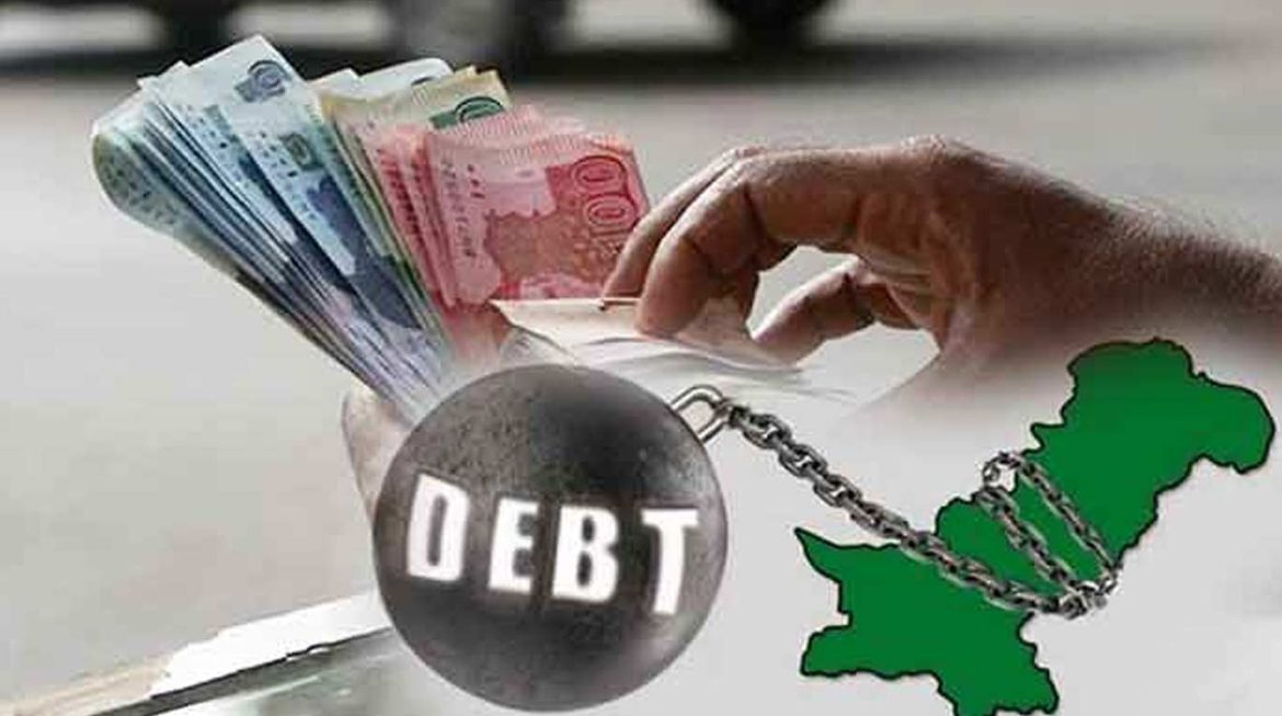 A hand holds currency notes, symbolizing debt, alongside a heavy ball labeled "DEBT" and a green map of Pakistan in the background.