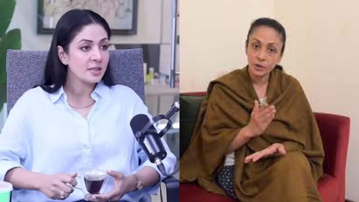 Two women engaged in conversation; one seated with a cup of tea, the other gesturing while wearing a shawl on a sofa.