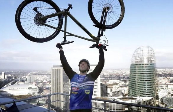 French TikTok Star Scales Eiffel Tower on a Bicycle, Setting New World Record