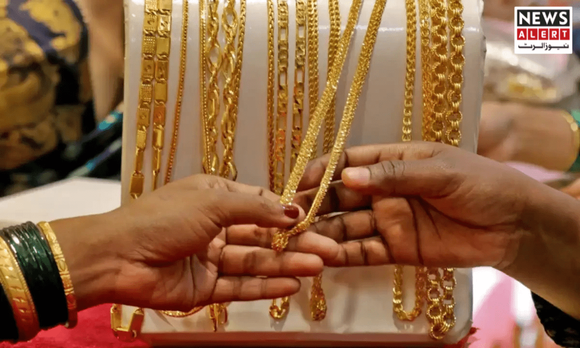 Two hands exchange a delicate gold chain amidst various gold necklaces on display, highlighting a jewelry shopping experience.