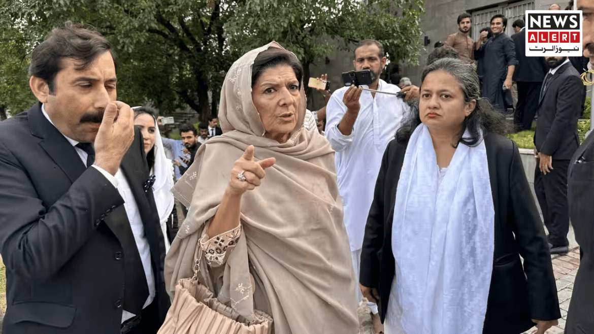 A group of people in formal attire discuss animatedly outdoors, surrounded by greenery and onlookers capturing the moment.