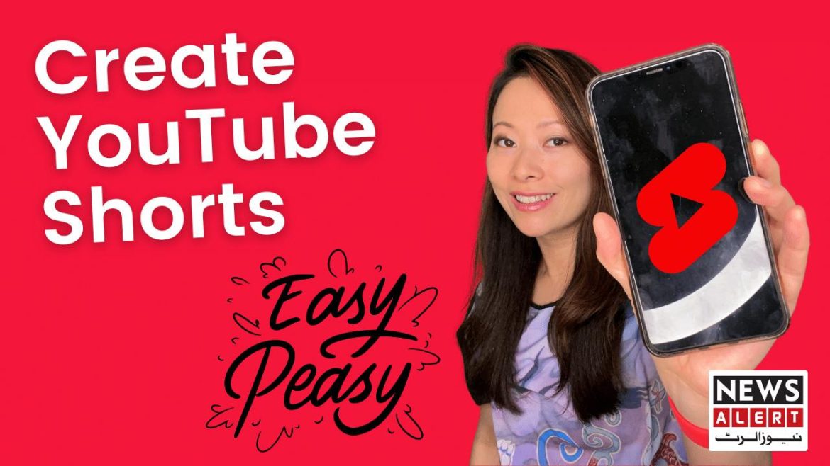 A person holds a smartphone displaying the YouTube Shorts logo, with vibrant red background text reading "Create YouTube Shorts Easy Peasy."