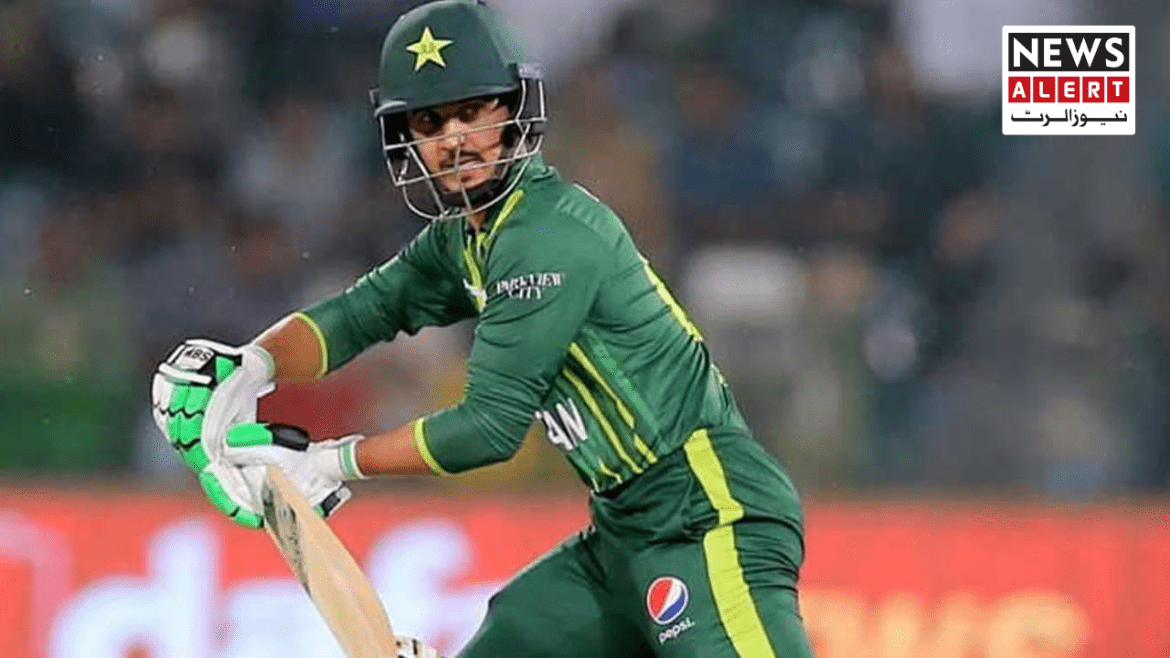 A cricketer in a green jersey with a star emblem prepares to hit the ball, showcasing focus and athletic stance during a match.