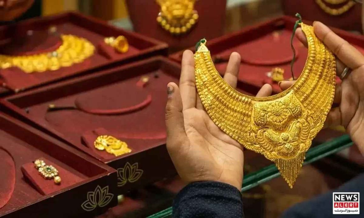 A person admires a stunning gold necklace, showcasing intricate designs, surrounded by various gold jewelry items.
